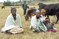 Ethiopian women and teen herding cows