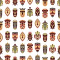 Ethnic african masks background. Wood mask tiki ritual. Art tribal hawaiian face totems. Colorful boho fabric print Royalty Free Stock Photo