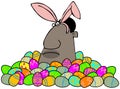 Ethnic Easter bunny in a pile of decorated eggs