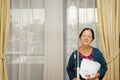 Ethnic elderly woman patient in hospital ward