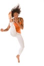 Ethnic fitness woman jumping kicking (motion blur