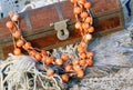 Ethnic handmade woodeny necklace and old wooden chest