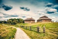 Ethnic house on rural landscape