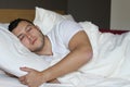 Ethnic male sleeping in comfortable position Royalty Free Stock Photo