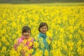 Ethnic minority girls in a field of canola