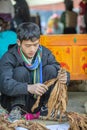 Ethnic minority man selling cigarettes, at old Van market Royalty Free Stock Photo