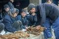 Ethnic minority man selling cigarettes, at old Van market