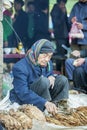 Ethnic minority man selling cigarettes, at old Van market Royalty Free Stock Photo