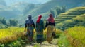 Ethnic minority women walking on rice terraces in mu cang chai, yen bai, vietnam