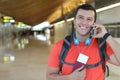 Ethnic passenger calling by phone from station