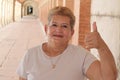 Ethnic senior woman giving a thumbs up Royalty Free Stock Photo