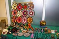 Ethnic souvenirs, baseball caps, bags with various pattern hanging in street market