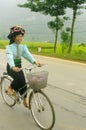 Ethnic Thai woman cycling