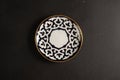 Ethnic Uzbek ceramic tableware on the black background