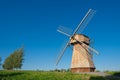 Ethnic Windmill on rural landscape