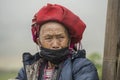 Ethnic woman from Red Dao minority group wearing traditional headdress near Ban Ho mountain village, Sapa District, Lao Cai, North Royalty Free Stock Photo