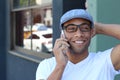 Ethnic Young Businessman Outside Office On Mobile Phone Royalty Free Stock Photo