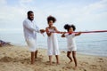 Ethnicity Happy Family Africans Enjoy playing on the beach summer vacation time happiness Royalty Free Stock Photo