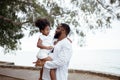 Ethnicity Happy Family Africans Enjoy relaxation resting on the beach summer vacation time Royalty Free Stock Photo