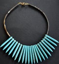 Ethnik necklace with turquoise and hematite on a black background