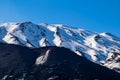 Etna - Black lava crater with vie on snow covered volcano mount etna in Catania, Sicily, Italy, Europe Royalty Free Stock Photo