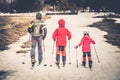 Family skiing on the snow on Mount Etna in Sicily