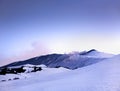 Etna - paesaggio invernale con neve al tramonto durante la blue hour sul vulcano Etna al crepuscolo - Sicilia Royalty Free Stock Photo