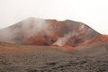 The Etna volcano. The Etna volcano crater. Black Volcanic Earth, Volcanic Lava and Stones. Dense Fog on Mount Etna. Place for Royalty Free Stock Photo