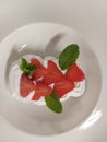 eton mess Fresh Berry Dessert with Mint Leaf on Plate