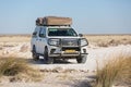 Etosha, Namibia, Africa, June 18, 2019: Toyota Hilux specially equipped for travel and Gipsy Adventure house on roof