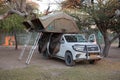 Etosha, Namibia, June 20, 2019: An off-road vehicle equipped for travel with roof top tents and a ladder to them. Camping in the