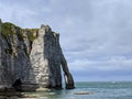 Etretat natural rock arch and its beach. Normandy, France