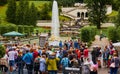 Group of tourists in front of the large fountain in the park of Linderhof Castle