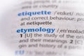 Etymology word in a dictionary. Selective focus, close up Royalty Free Stock Photo
