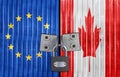 EU and Canada flag on door with padlock Royalty Free Stock Photo