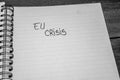 EU crisis, handwriting text on paper, political message. Political text on office agenda. Concept of democracy, voting, politics