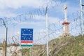 EU Entrance roadsign blocked by the Border fence