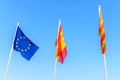 EU flag Spanish flag local Ibiza flag waving in the wind on blue sky background Royalty Free Stock Photo