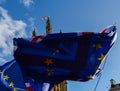 EU flags and British flag in front of each other with Victoria Tower, Westminster, London, UK in background - Brexit Royalty Free Stock Photo