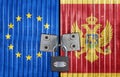 EU and Montenegro flag on door with padlock