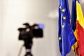 EU and Romania flags during press conference Royalty Free Stock Photo