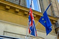 EU and UK flags coalition together. European Union and United Kingdom flags next to each other. Royalty Free Stock Photo