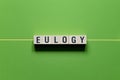 Eulogy - word concept on cubes Royalty Free Stock Photo