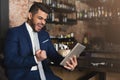 Euphoric businessman winning and watching at tablet