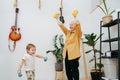 Euphoric granny doing phisical exercises with her grandson, tries to encourage Royalty Free Stock Photo