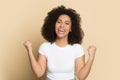 Euphoric laughing happy african american young lady making yes gesture. Royalty Free Stock Photo