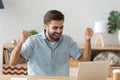 Euphoric young man celebrating success excited by online bet win Royalty Free Stock Photo