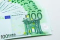 Isolated pile of 100 EUR banknotes