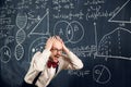 Eureca. Excited and emotional scientist, teacher expressing feeling, finding out solution. Formulas and calculations on Royalty Free Stock Photo