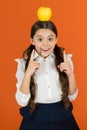 Eureka concept. Distributing free fresh fruit at school. Girl kid school uniform. Schoolgirl with apple. School lunch Royalty Free Stock Photo